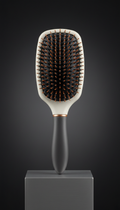 Ergonomic paddle brush with metallic accents