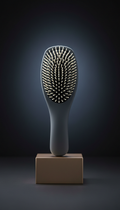 Sleek detangling brush with silicone grip
